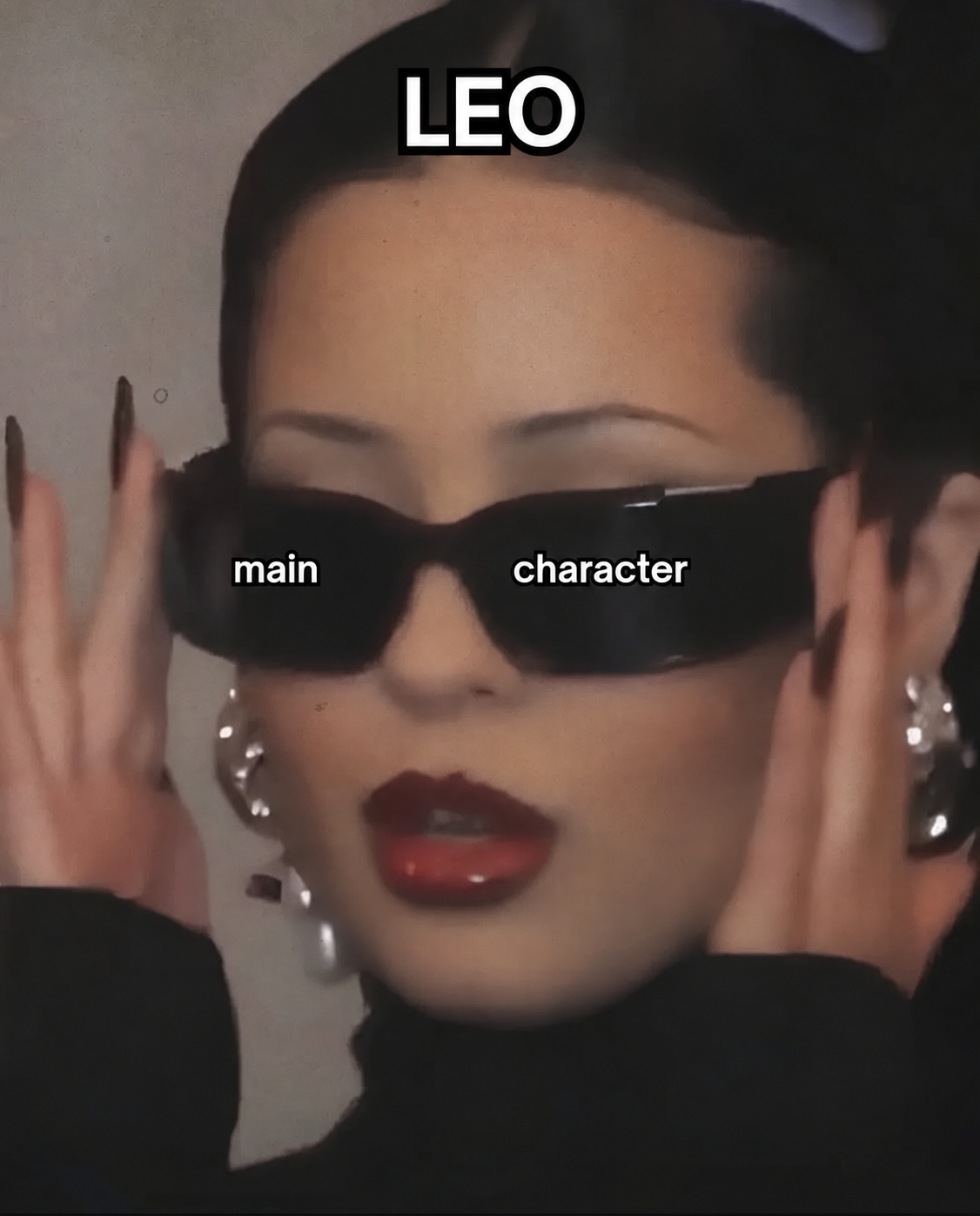 Leo main character meme: a woman wearing black sunglasses.